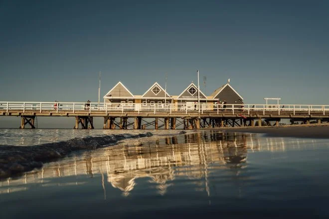 Busselton Jetty and its interpretive centre building reaching out over Geographe Bay